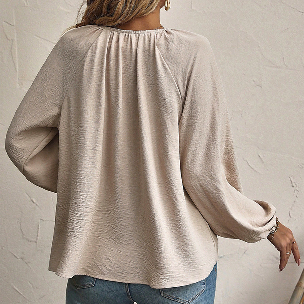 Beige balloon-sleeve blouse, back view