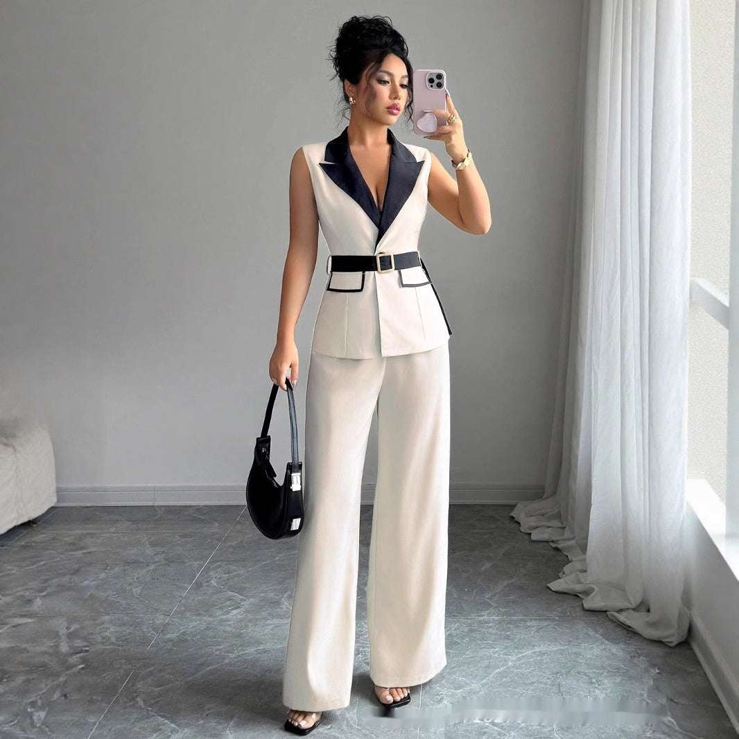 Ivory sleeveless belted blazer top with navy lapel and wide-leg pants, front view