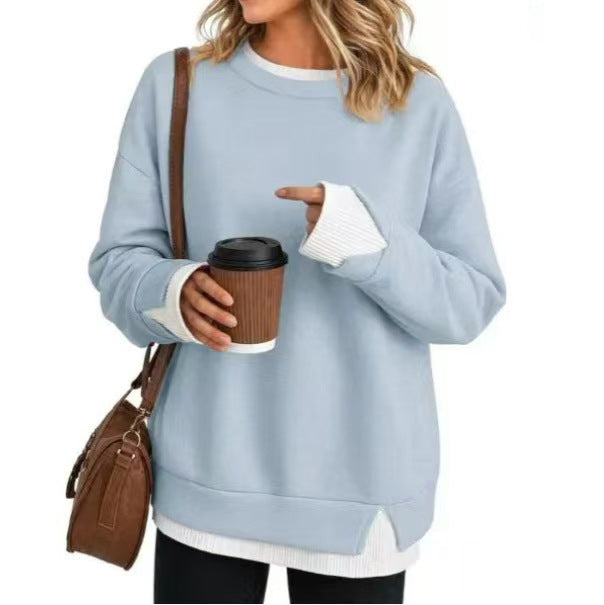 Double-layer crewneck sweater in light blue with white layered cuffs and hem, front view