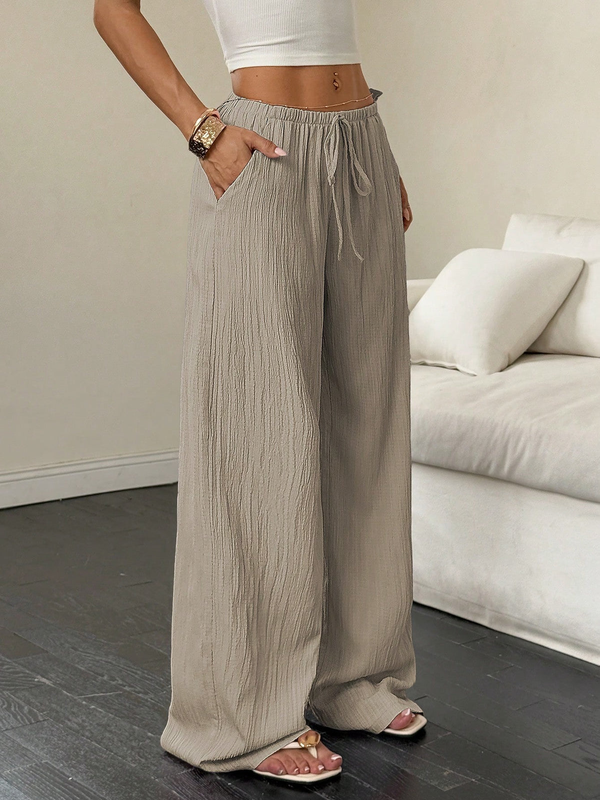 Drawstring wide-leg pants with a textured finish in taupe, front view