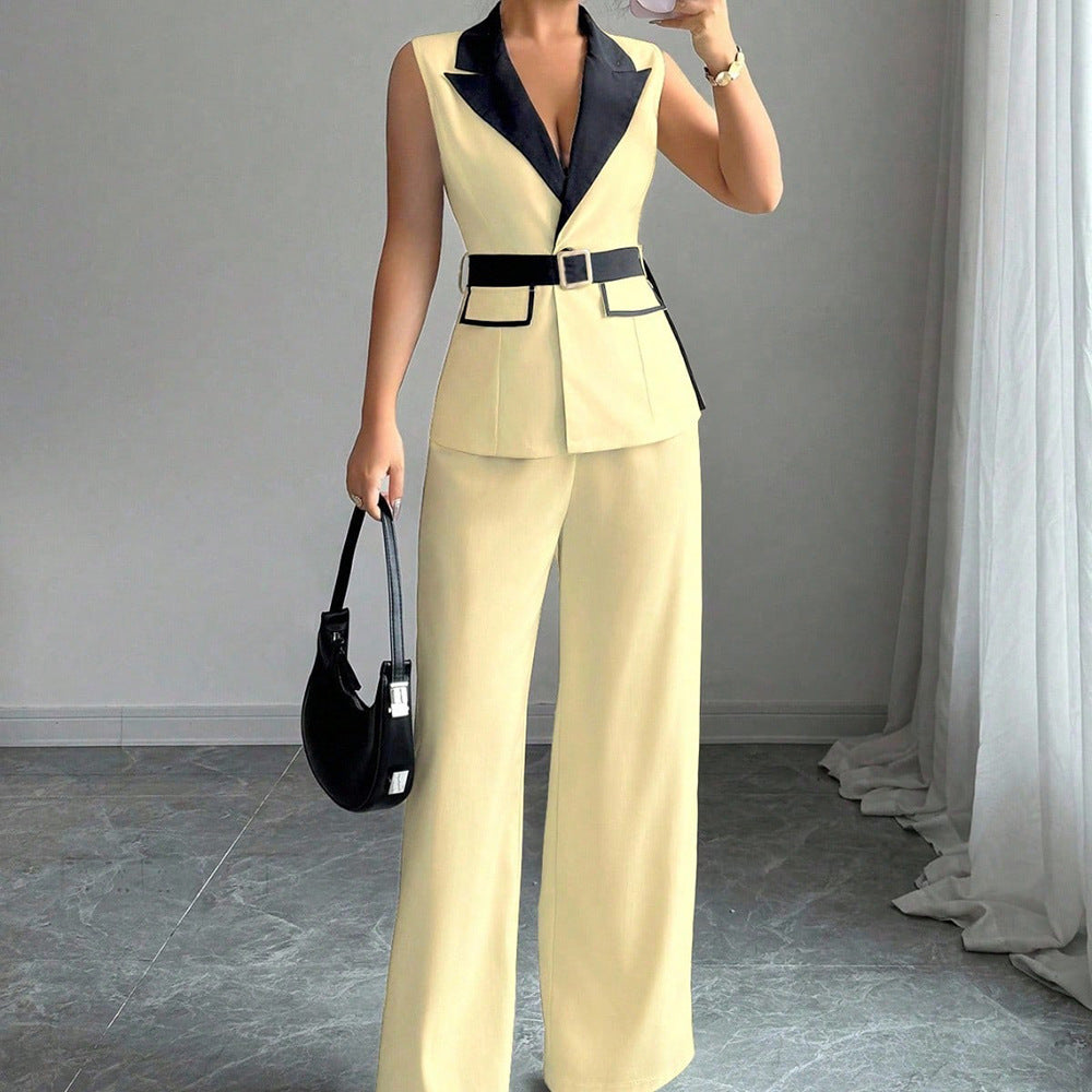 Pale yellow sleeveless belted blazer top with navy lapel and matching wide-leg pants