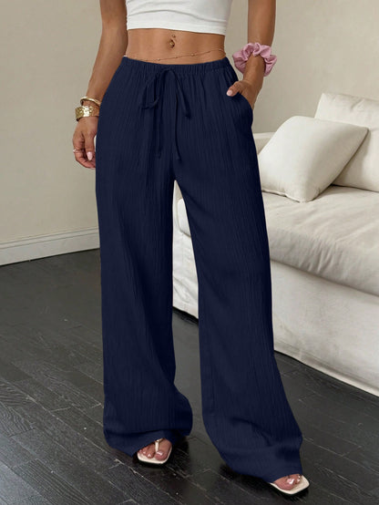 Drawstring wide-leg pants with a textured finish in navy, front view