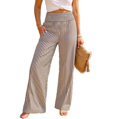 Wide-leg pants in brown and cream stripe with a smocked high waist, front view