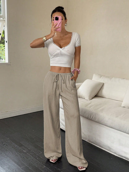 Drawstring wide-leg pants with a textured finish in taupe, front view