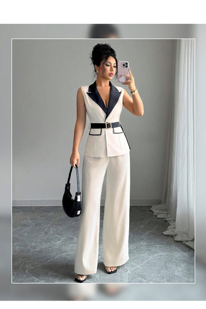 Ivory sleeveless belted blazer set with navy lapel, framed front view