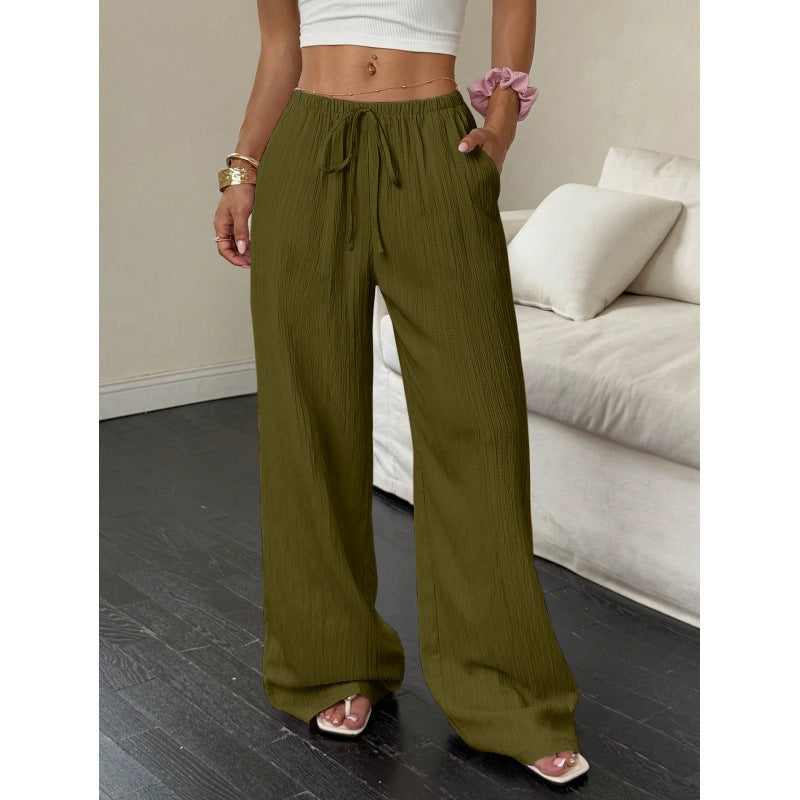 Drawstring wide-leg pants with a textured finish in olive green, front view