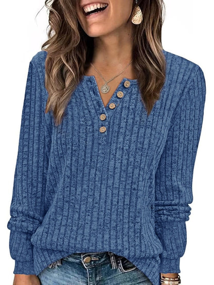 Ribbed long-sleeve button-neck top in denim blue, worn with jeans