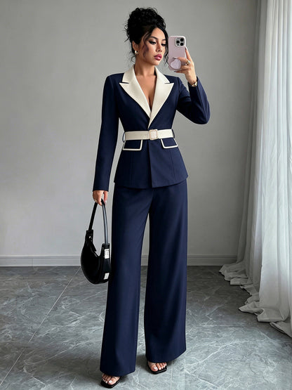 Navy long-sleeve belted blazer with white lapel and matching wide-leg pants