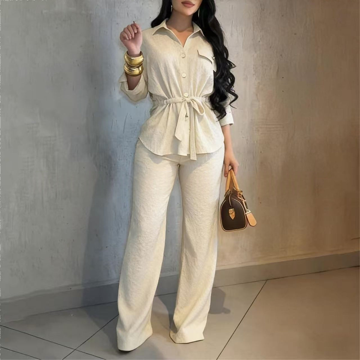 Lapel collar belted shirt and wide-leg pants set in cream, front view