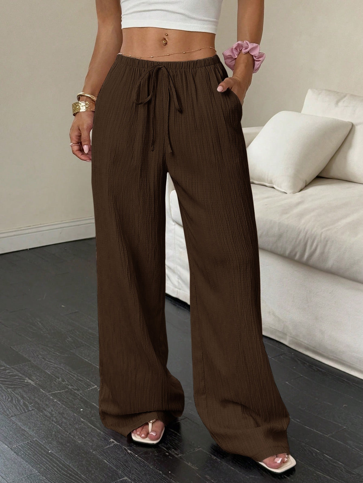 Drawstring wide-leg pants with a textured finish in chocolate brown, front view