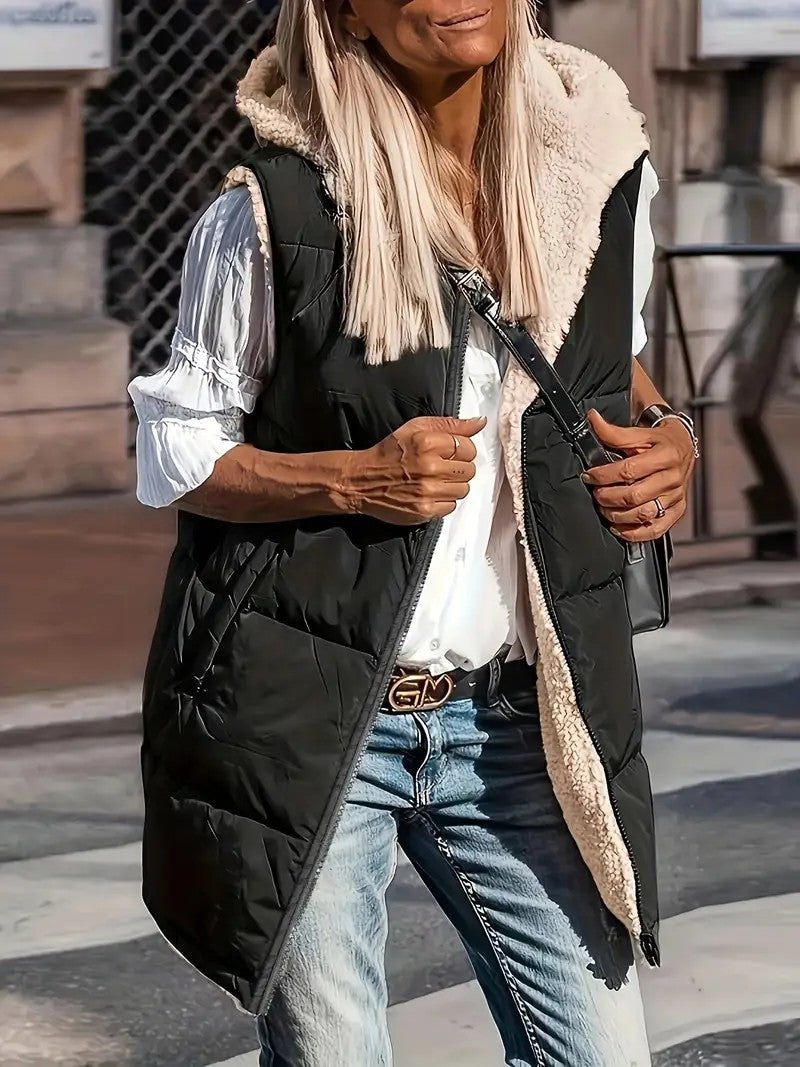 Black long quilted hooded vest with sherpa lining, worn open