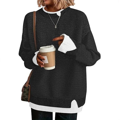Double-layer crewneck sweater in black with white layered cuffs and hem, front view