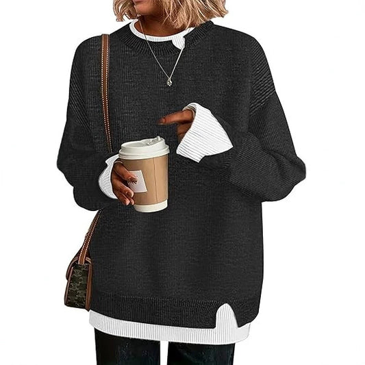 Double-layer crewneck sweater in black with white layered cuffs and hem, front view