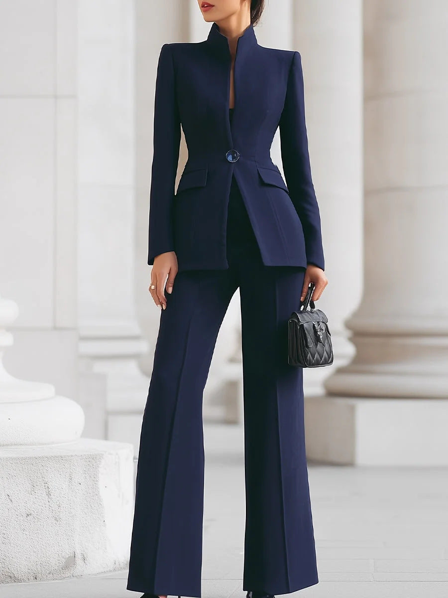 Navy stand-collar fitted blazer and flare pants set styled with a black handbag