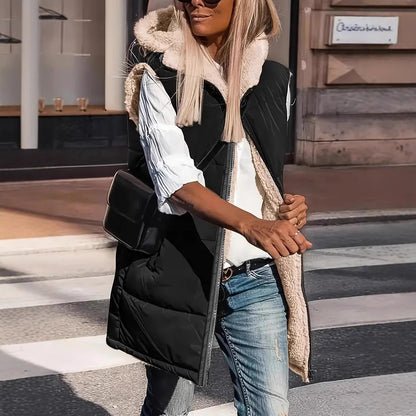 Black long quilted hooded vest with sherpa lining, worn with jeans