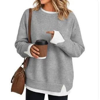 Double-layer crewneck sweater in light gray with a white layered hem, front view