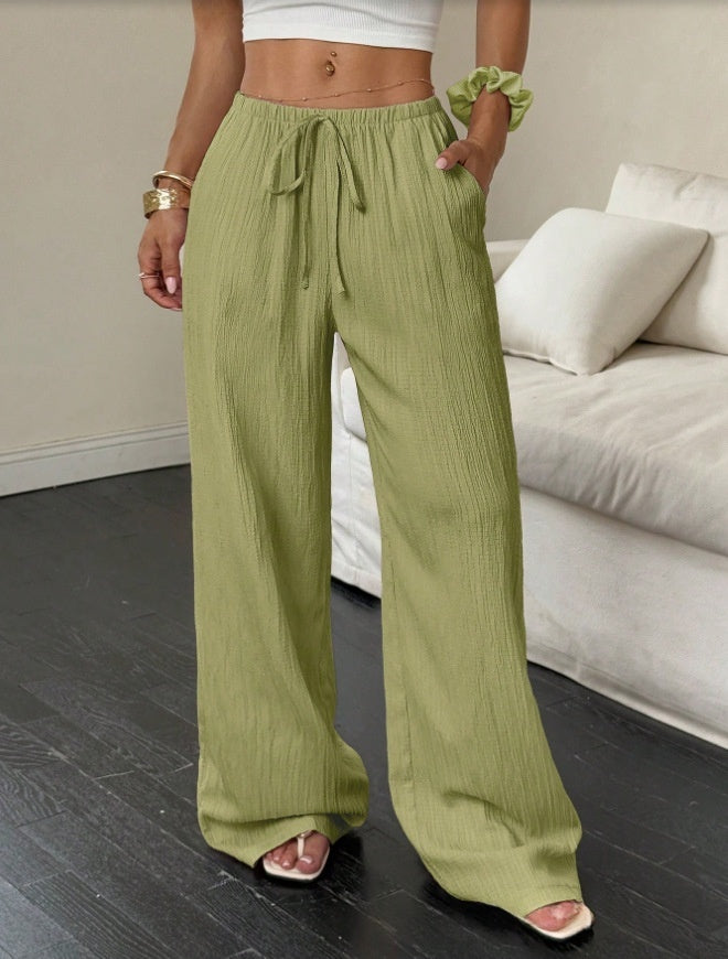 Drawstring wide-leg pants with a textured finish in pistachio green, front view