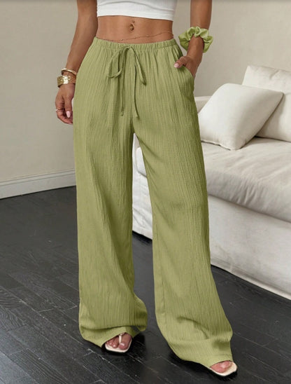 Drawstring wide-leg pants with a textured finish in pistachio green, front view