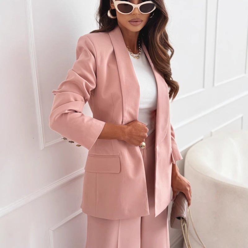 Dusty pink blazer close-up showing lapel and flap pockets