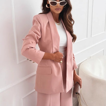 Dusty pink blazer close-up showing lapel and flap pockets