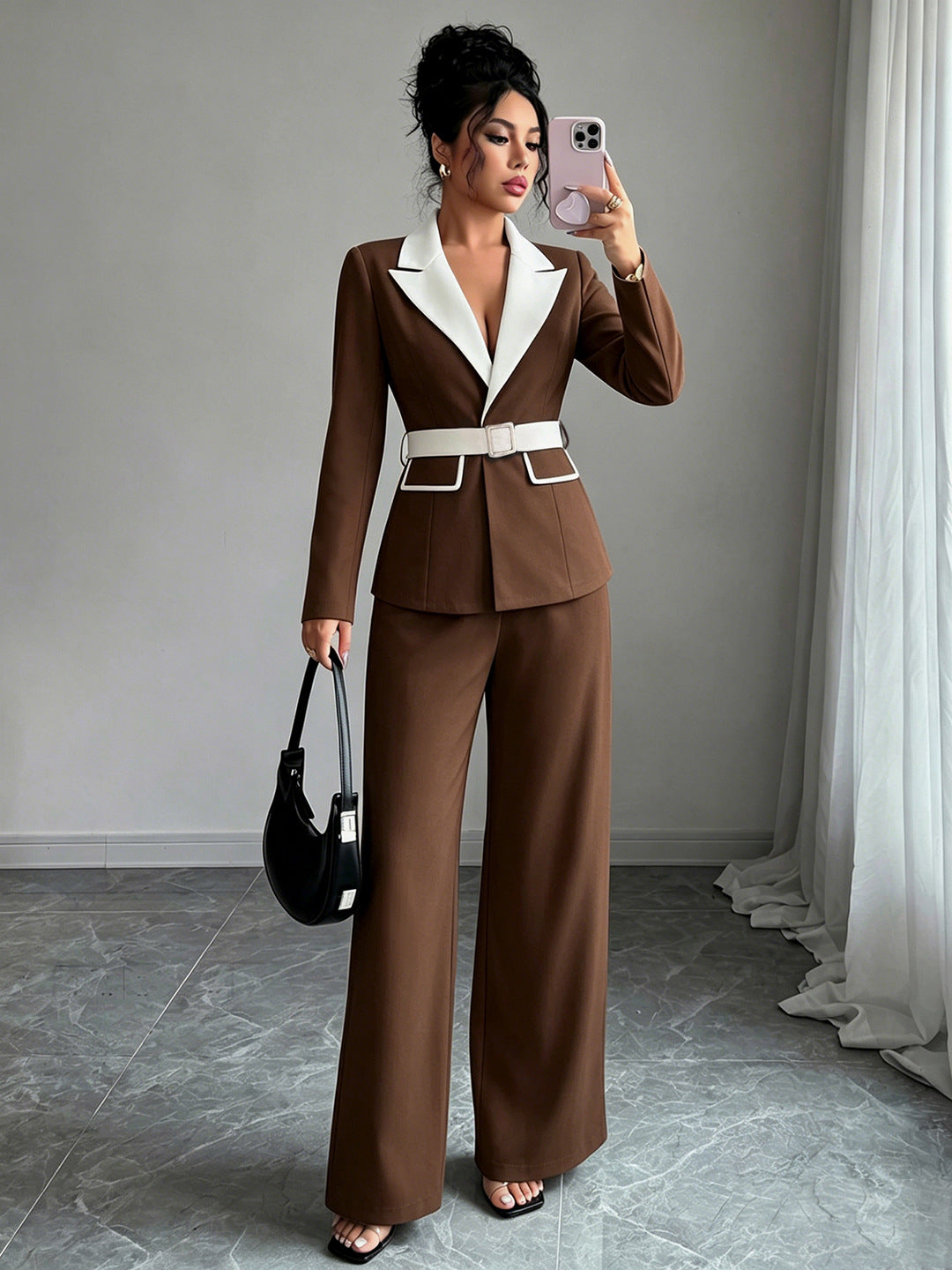 Brown long-sleeve belted blazer with white lapel and matching wide-leg pants