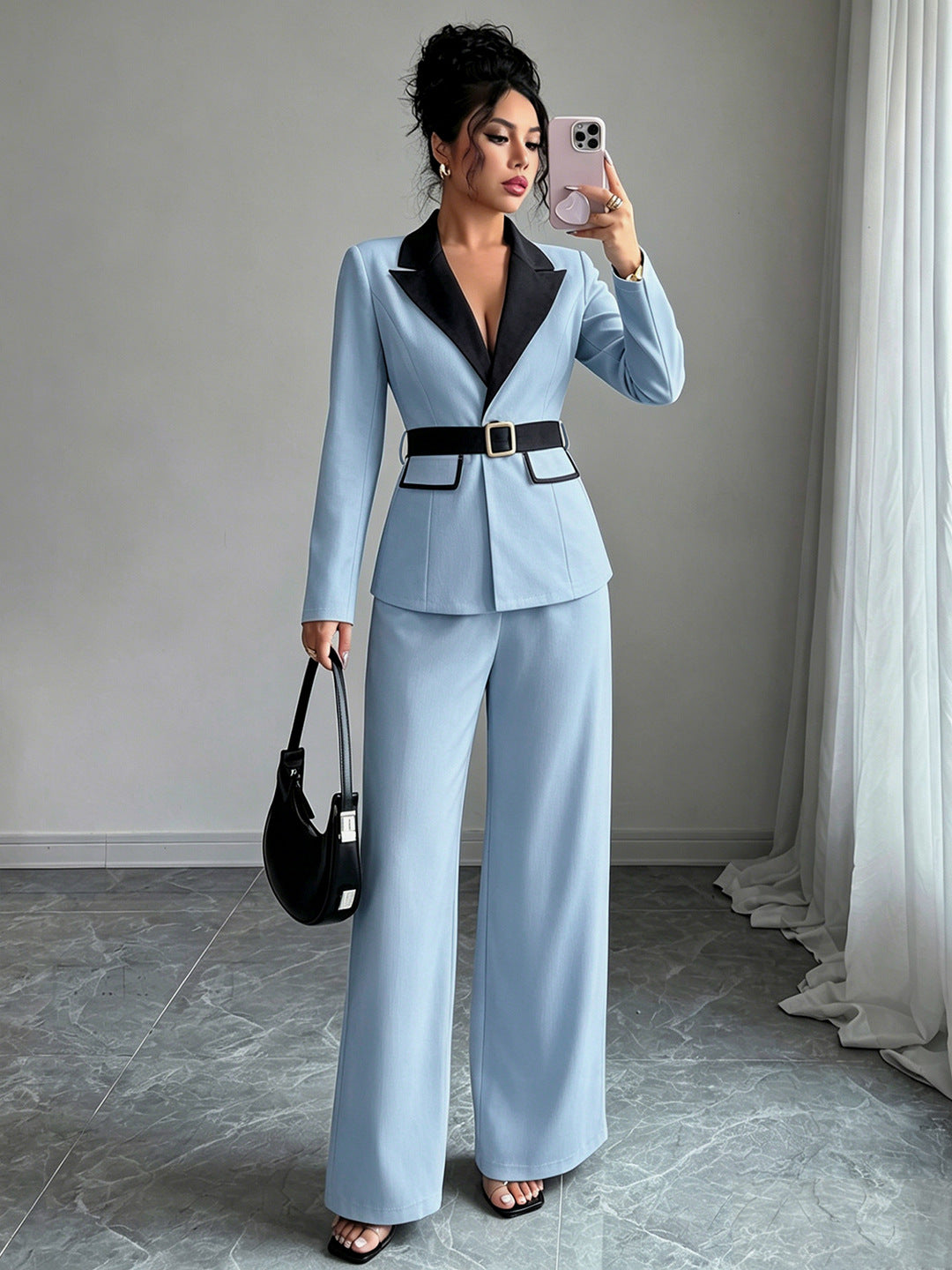 Light blue long-sleeve belted blazer with navy lapel and matching wide-leg pants