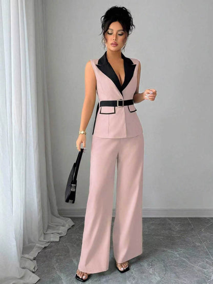 Pink sleeveless belted blazer top with navy lapel and matching wide-leg pants, front view