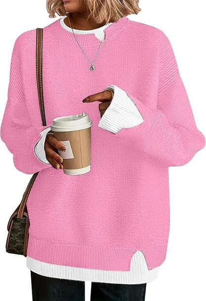 Double-layer crewneck sweater in bright pink with white layered cuffs and hem, front view