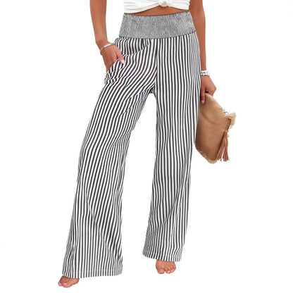 Wide-leg pants in black and white stripe with a smocked high waist, front view