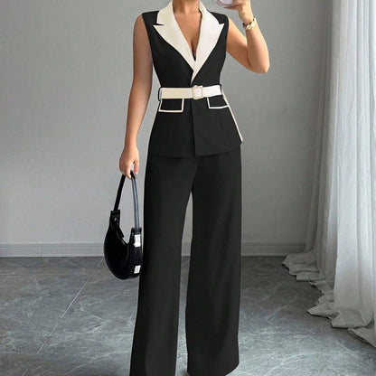 Black sleeveless belted blazer top with white lapel and matching wide-leg pants