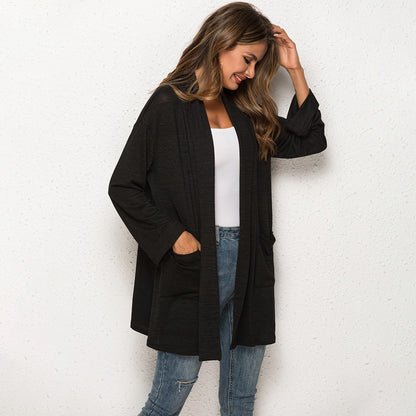 Black longline cardigan with patch pockets, side view