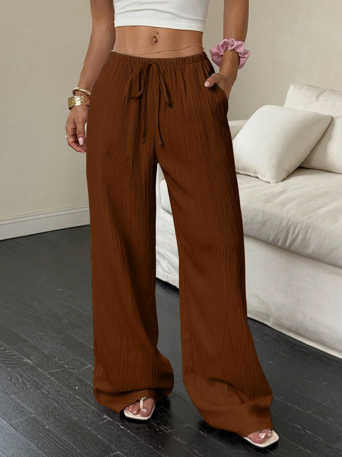 Drawstring wide-leg pants with a textured finish in chestnut brown, front view