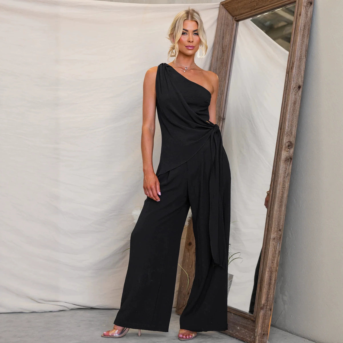One-shoulder tie-waist top and wide-leg pants set in black, front view