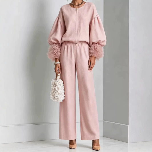 Blush pink zip-front top with balloon sleeves and feather-trim cuffs with matching wide-leg pants
