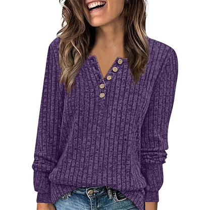Ribbed long-sleeve button-neck top in purple, worn with jeans