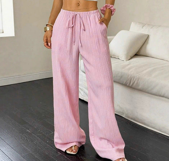 Drawstring wide-leg pants with a textured finish in pink, front view