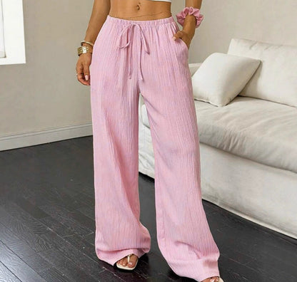 Drawstring wide-leg pants with a textured finish in pink, front view