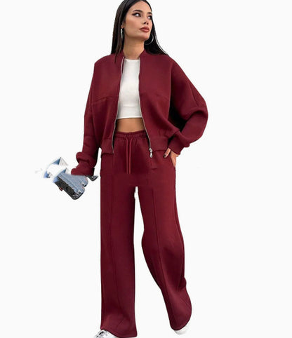 Burgundy zip-front jacket and drawstring wide-leg pants set worn with a white crop top