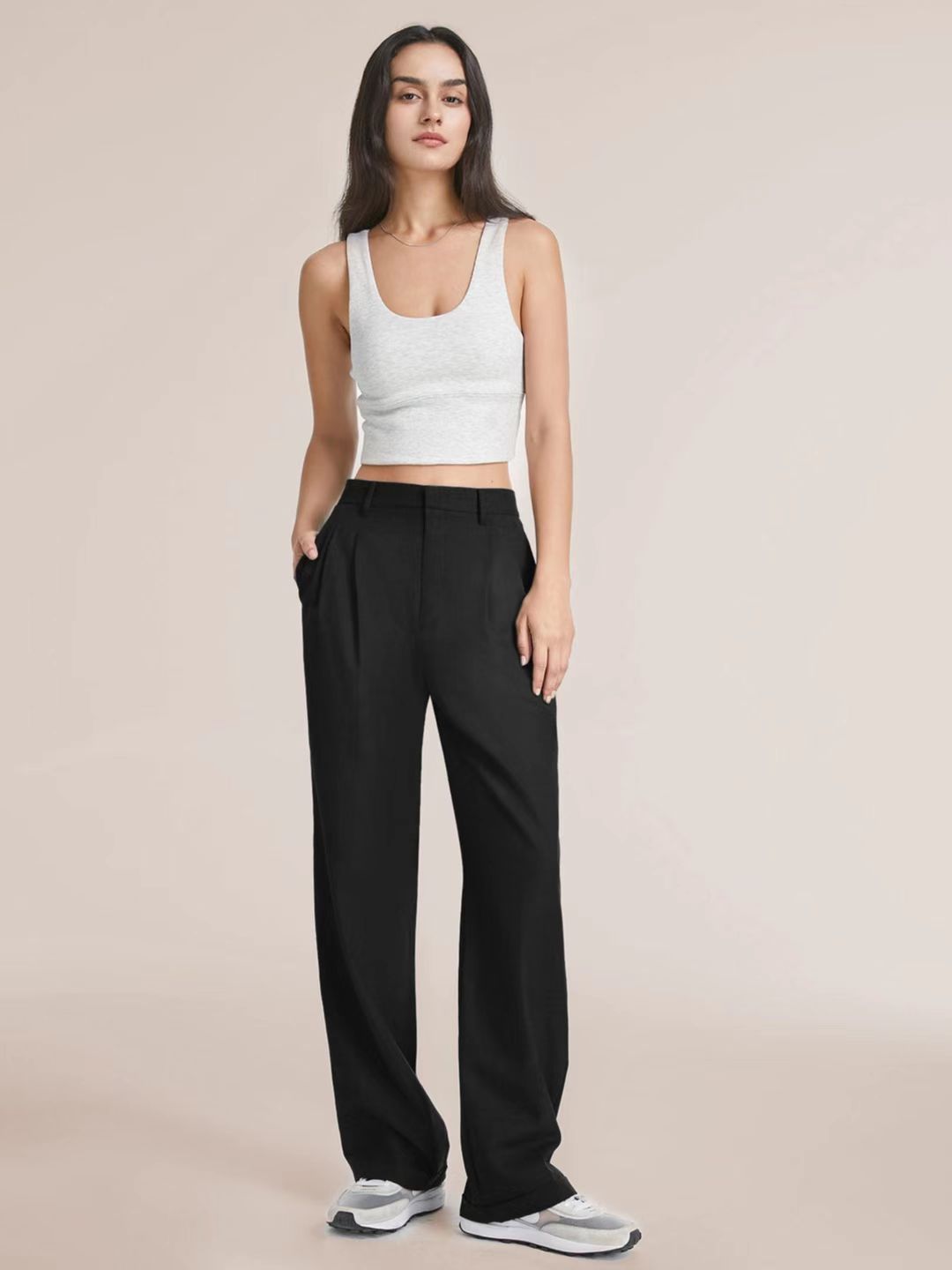 High-waist pleated wide-leg pants in black, front view