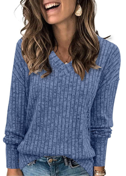 Ribbed V-neck long-sleeve top in cornflower blue, worn with jeans