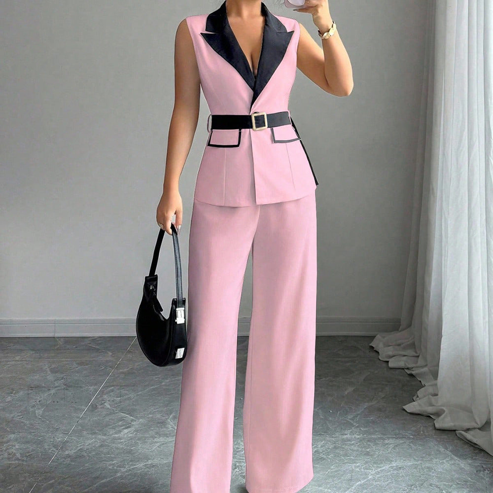 Pink sleeveless belted blazer top with navy lapel and matching wide-leg pants