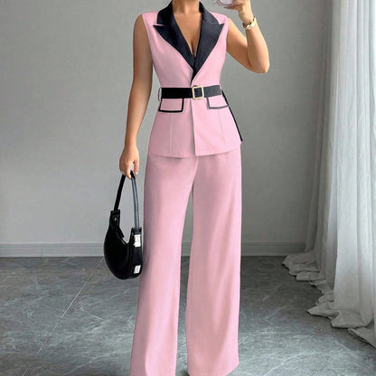 Pink sleeveless belted blazer top with navy lapel and matching wide-leg pants