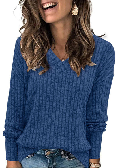 Ribbed V-neck long-sleeve top in royal blue, worn with jeans