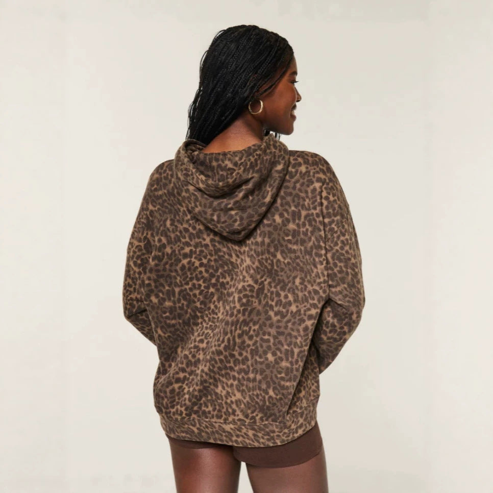 Leopard print pullover hoodie, back view worn with brown shorts