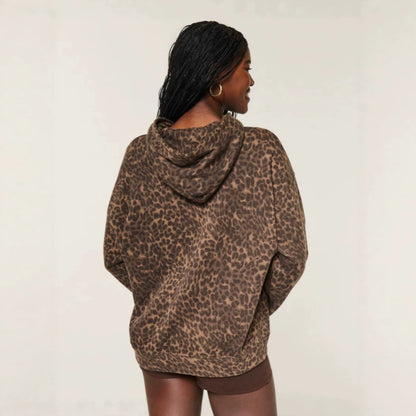 Leopard print pullover hoodie, back view worn with brown shorts