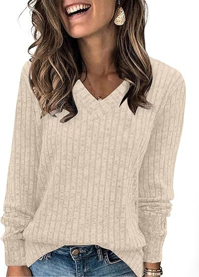 Ribbed V-neck long-sleeve top in cream, worn with jeans