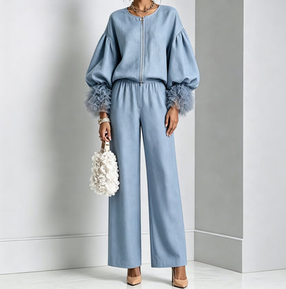 Sky blue zip-front balloon sleeve top with feather-trim cuffs and wide-leg pants