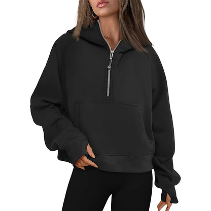 Cropped half-zip hoodie with front pocket and thumbholes in black